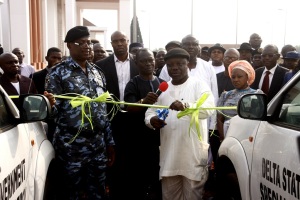  Gov. Emmanuel Uduaghan (middle), of Delta State, Mr. Ikechukwu Aduba, (L), State Commissioner of Police, Comrade Ovuozorie Macaulay, SSG and Mrs Chinwe Olaranwaju, Oshimili South Caretaker Committee Chairman during the commissioning of a 30 police high way patrol van purchased by the state government at the new government house, Asaba
