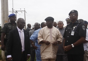 Gov. Uduaghan (middle) flanked by Comrade Macaulay, SSG (left) & Police Commissioner Ikechukwu Aduba (right)