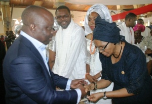 Governor Emmanuel Uduaghan of Delta State (left) condoling Lady Dorothy Ebo during the funeral service of her husband, Late Sir Michael Ebo