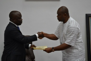 Governor Uduaghan (left) receiving the copies of the bills from the Speaker Delta State House of Assembly (DTHA) Rt Hon Victor Ochei ( after the signing of 2014 appropriation bill into law