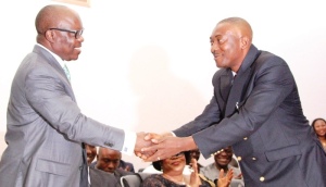 Governor Emmanuel Uduaghan of Delta State (left), congratulating Mr. Pastor Powell Ojogho, shorly after swearing him in as one of the Commissioners in the State Excutive Council in Asaba