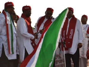 The National Chairman, PDP, Adamu Mu'Azu (second right) presenting the Party's flag to the Delta flag bearer Senator Ifeanyi Okowa (second left) the director general presidencial campaign organization, Peter Obi (left) the running mate to Senator Okowa, Kingsley Otuaro, during PDP presidential campaign in Asasa on Wednesday Photo: Goddy Umukoro