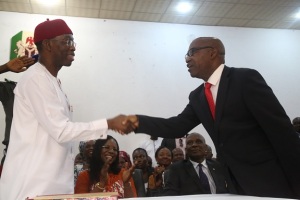 Delta State Governor, Senator (Dr.) Ifeanyi Arthur Okowa (left) Congratulating Hon. Festus Agas, after being Sworn in as the new Secretary to the State Government