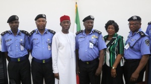 Delta State Governor, Senator Ifeanyi Okowa (3rd left) in group photograph with the AIG and his Team