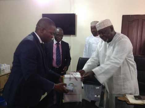 Commissioner, Bureau for Special Duties, Delta State, Hon. Chika Ossai (left) receiving water treatment filters to assist flood victims from the Chairman, Greenwork Matters Limited, Hon. Idi Farouk who made the donationss in Asaba, while the  Permanent Secretary, Bureau for Special Duties, Mr Benson Oboro, and Mr Jafar Farouk watches in admiration. 