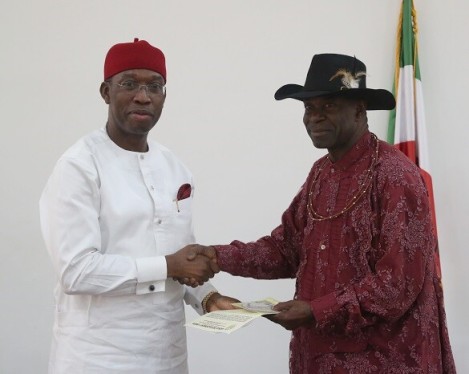 Delta State Governor, Senator Ifeanyi Okowa (left) and the President Isoko Development Union, High Chief Iduh Amadhe, during a courtesy call on the Governor, in Asaba.