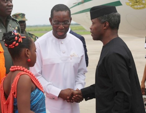 Delta State Governor, Senator Ifeanyi Okowa (left) in warm a handshake with the Vice President, Federal Republic of Nigeria, Prof. Yemi Osibanjo, during his Visit to Osubi Airport Warri, Delta State.