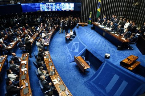The final score of a Senate vote with an overwhelming 55-22 on suspending Brasilian President Dilma Rousseff and launching an impeachment trial is pictured on a large screen inside the Senate in Brasilia on May 12, 2016. Brazilian President Dilma Rousseff was suspended on May 12 to face impeachment, ceding power to her vice-president-turned-enemy Michel Temer in a political earthquake ending 13 years of leftist rule over Latin America's biggest nation. / AFP / EVARISTO SA        (Photo credit should read EVARISTO SA/AFP/Getty Images)