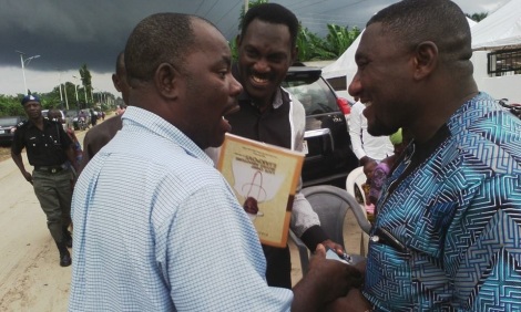 Dr. Paul Oweh (right) condoles with Dr. (Pharm.) Nelson Ejakpovi during the Service of Songs