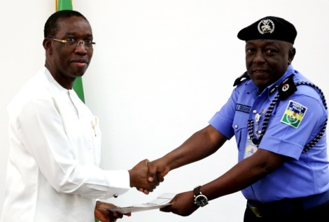 Delta State Governor, Senator Ifeanyi Okowa (left), receiving a copy address from the new CP. Mr. Zanna Ibrahim during a courtesy call by the latter on the Governor in Asaba 