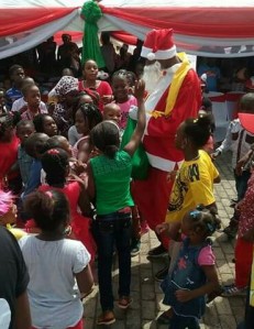 Father Christmas cheers with kids